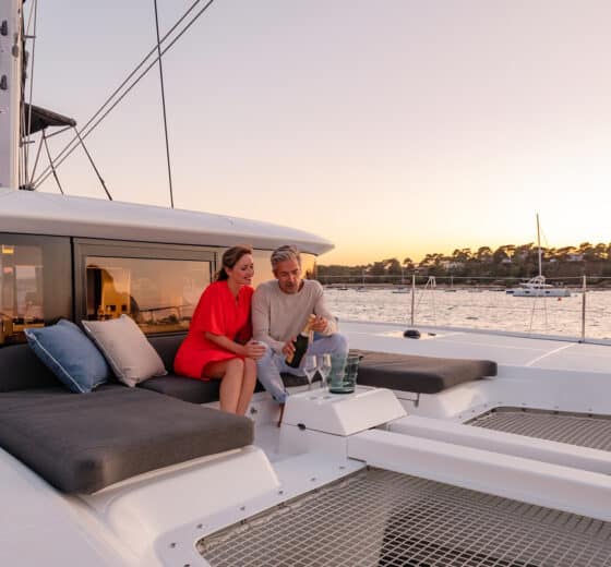 Acacia Agave catamaran onboard guests on deck relaxing