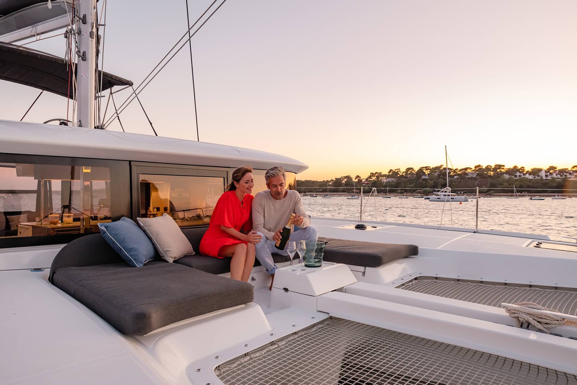 Acacia Agave catamaran onboard guests on deck relaxing