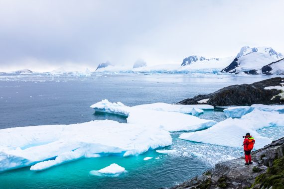 Antarctica Tecla man on ice cliff