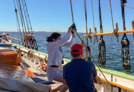 Aron guests onboard pulling ropes underway sailing onboard traditional tall ship
