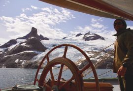 At helm of Tecla sailing in Greenland