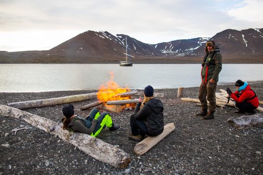 Beach bonfire on Svalbard with Valiente anchored