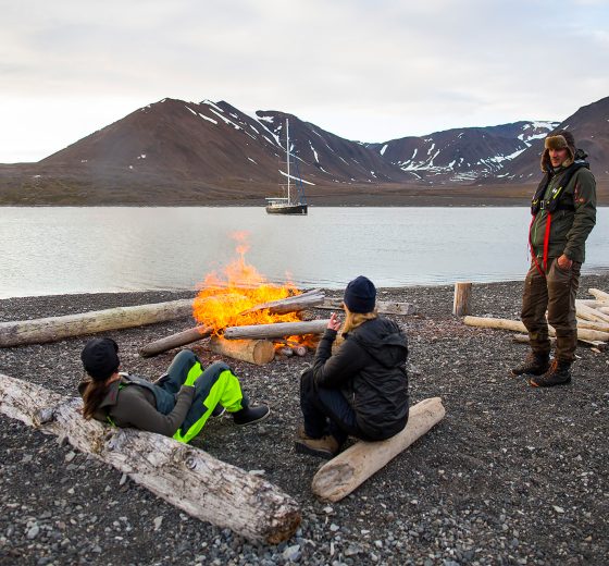 Beach bonfire on Svalbard with Valiente anchored