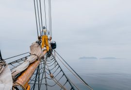 Bessie Crew on bowsprit