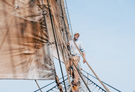 Bessie Ellen guest climbing on the bowsprit
