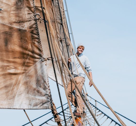 Bessie Ellen guest climbing on the bowsprit