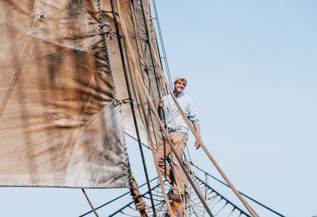 Bessie Ellen guest climbing on the bowsprit