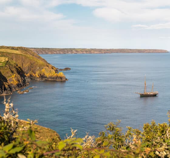 Bessie Ellen tall ship anchored off Cornish coast, Cadgwith, Cornwall