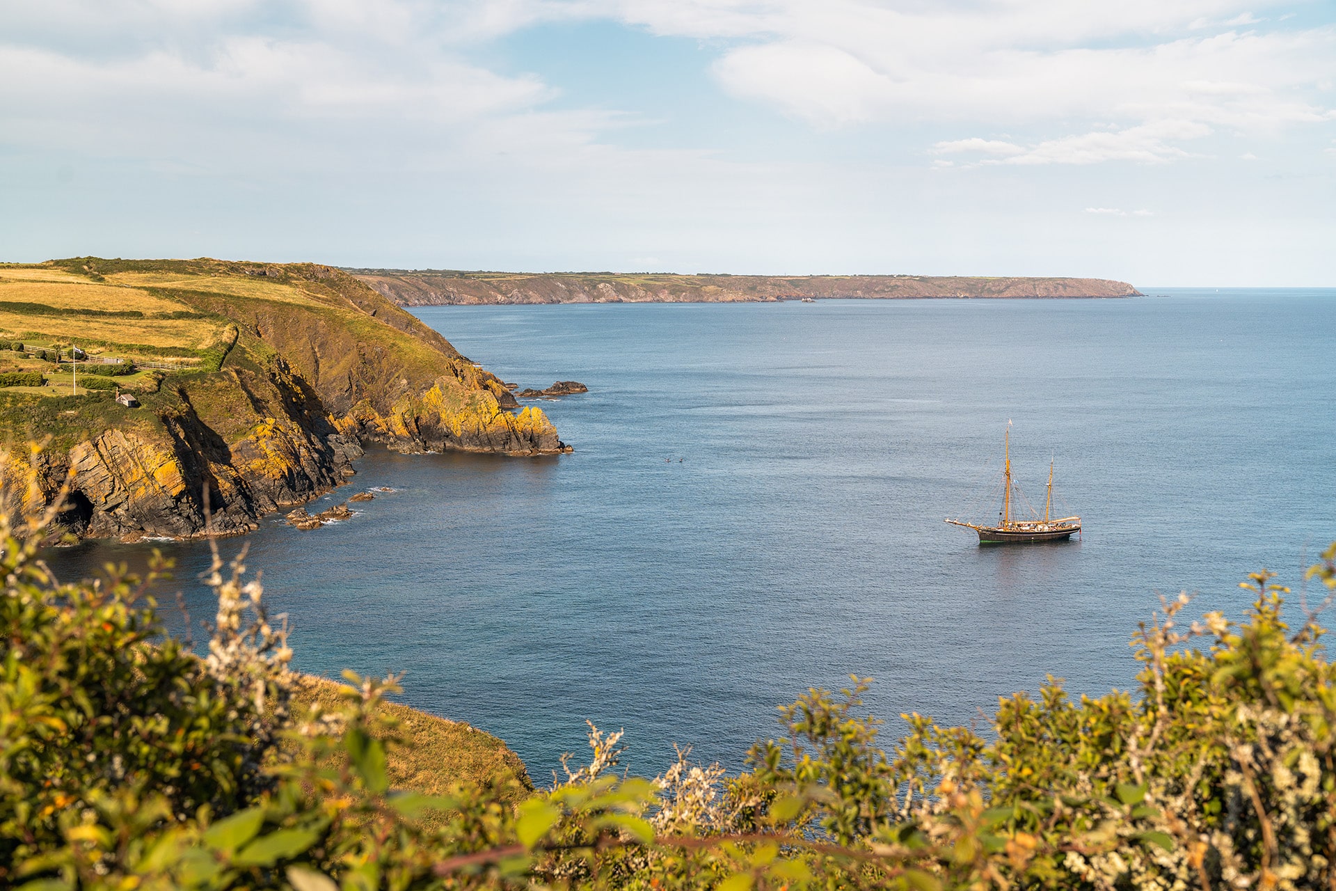 Bessie Ellen tall ship anchored off Cornish coast, Cadgwith, Cornwall