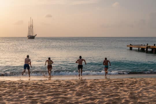 Blue Clipper guests on beach in Caribbean, Mayreau