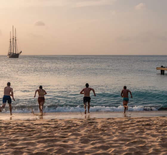 Blue Clipper guests on beach in Caribbean, Mayreau