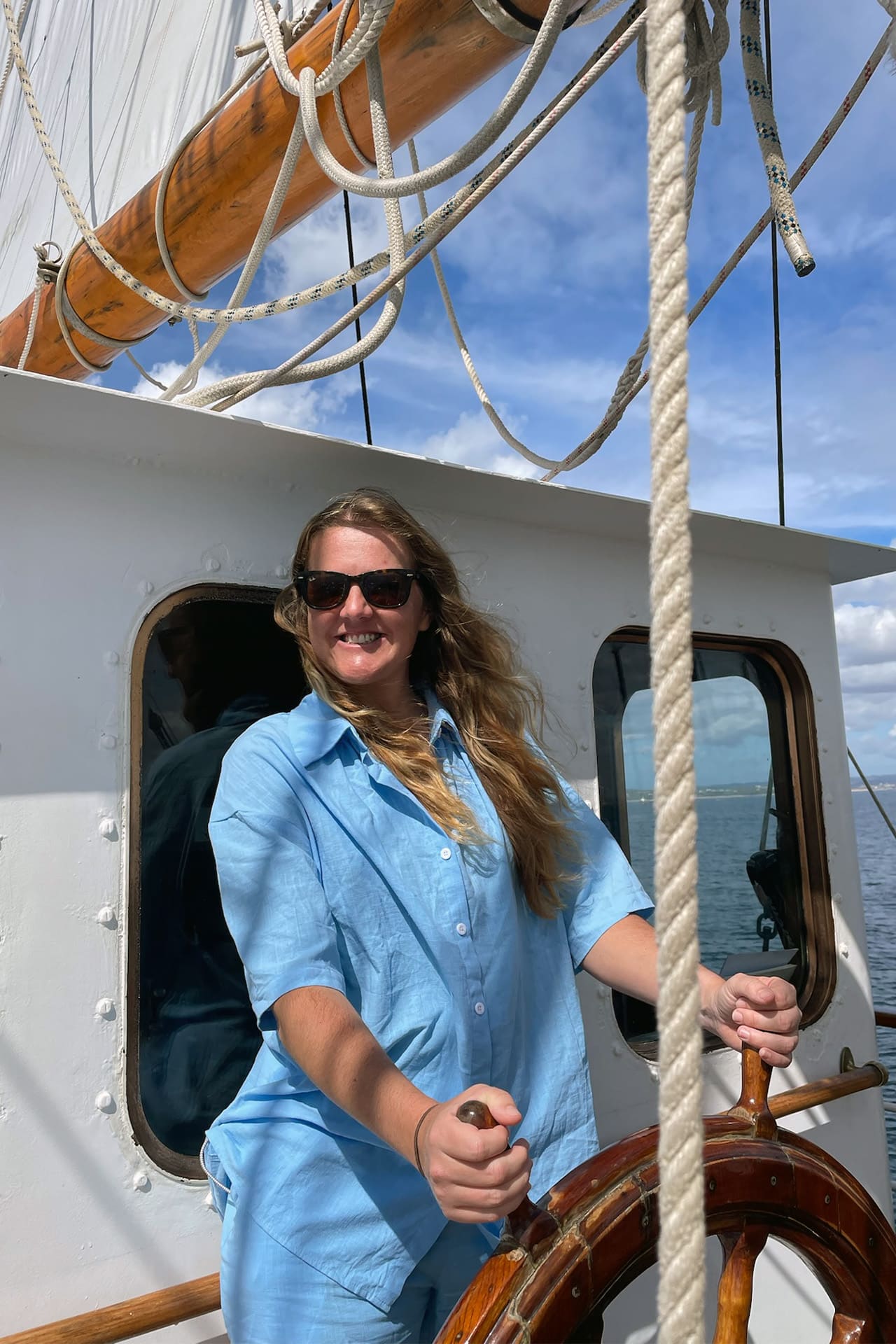 Blue Clipper tall ship guest at helm