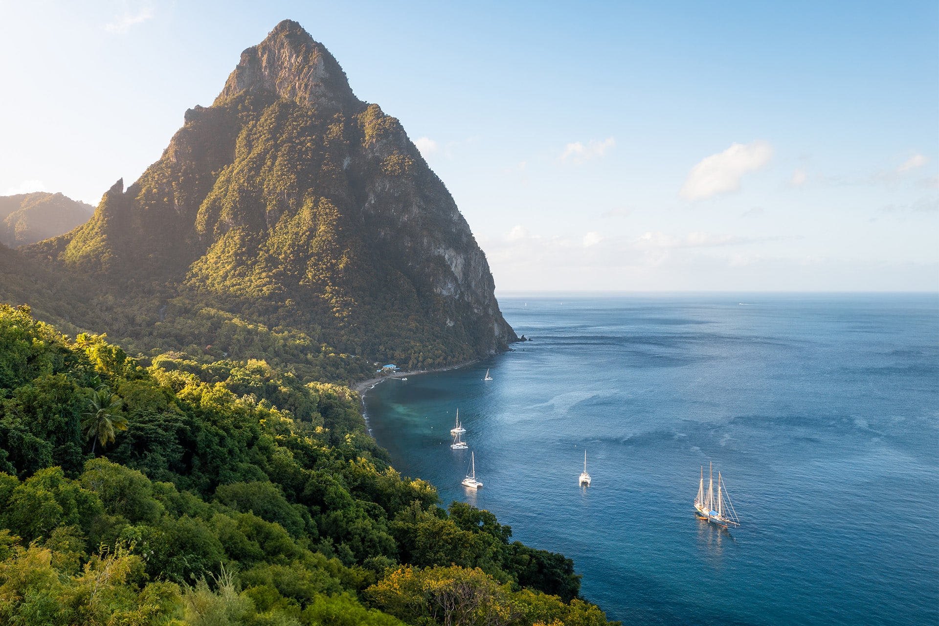 Caribbean morning sunlight at Petit Piton, St Lucia, Blue Clipper anchored