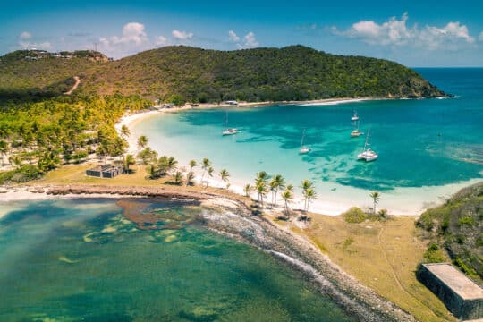 Caribbean view of boats anchored in bay in the Grenadines