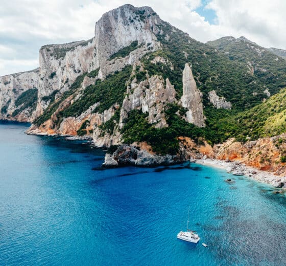Catamaran anchored at Cala Goloritze, Sardinina, Italy