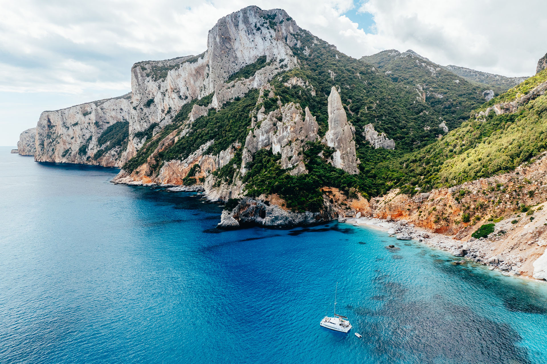 Catamaran anchored at Cala Goloritze, Sardinina, Italy