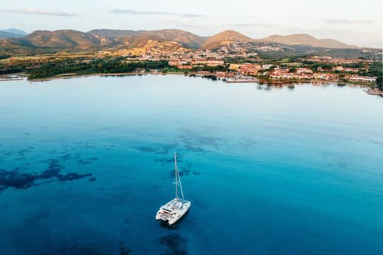 Catamaran anchored at Porto San Paolo, Sardinia Coast, Italy
