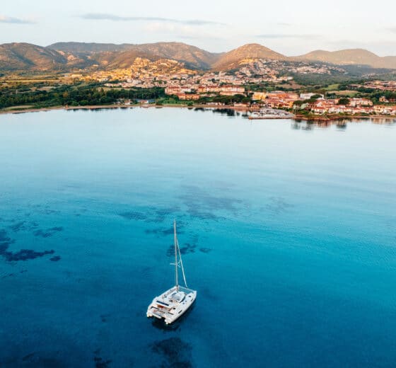 Catamaran anchored at Porto San Paolo, Sardinia Coast, Italy