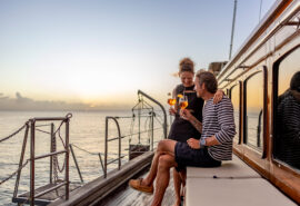 Chronos guests onboard at sunset drinks on deck