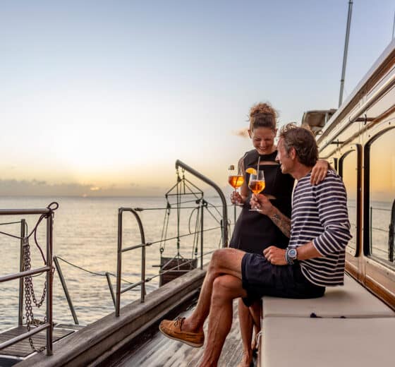 Chronos guests onboard at sunset drinks on deck