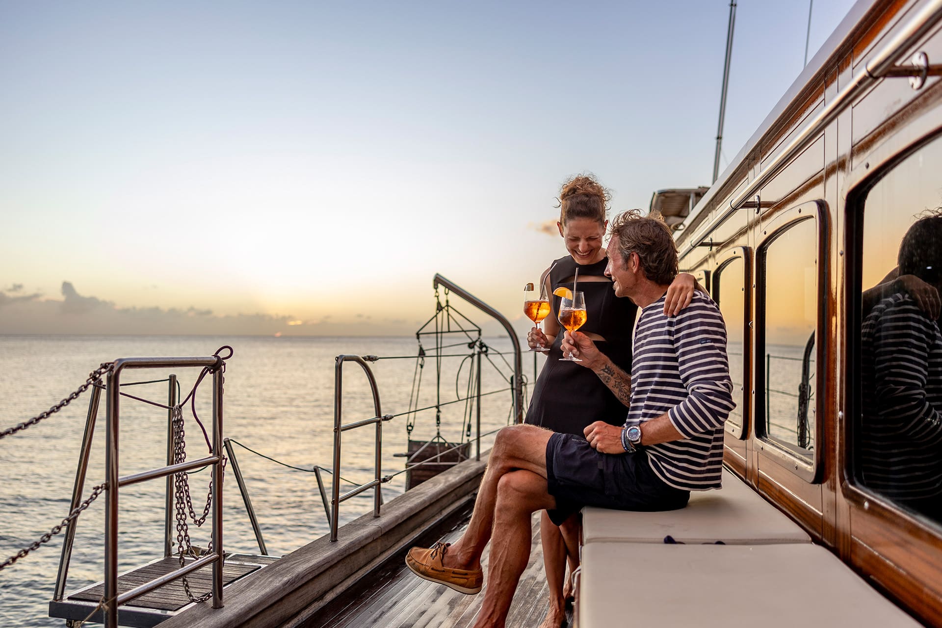 Chronos guests onboard at sunset drinks on deck