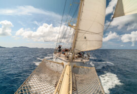 Chronos yacht from bowsprit sunshine sailing