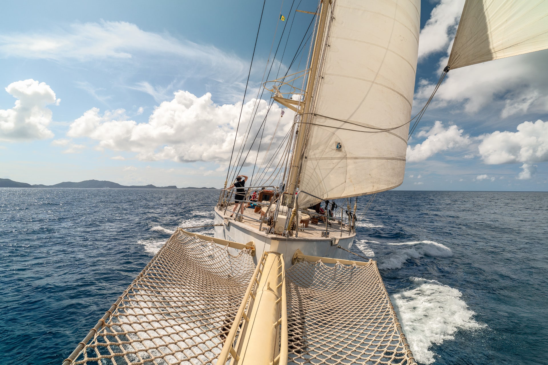Chronos yacht from bowsprit sunshine sailing