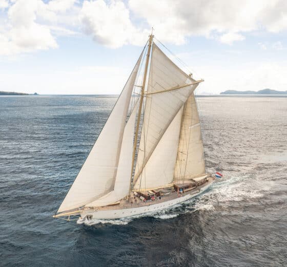 Chronos yacht underway full sail sailing off coast