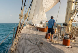 Chronos yacht underway on deck sunshine sailing crew