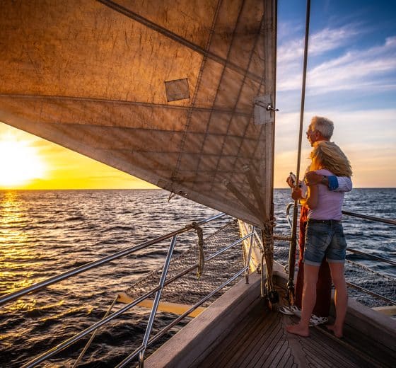 Couple on board SC yacht watching the sunset Chronos Rhea