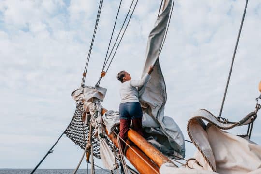 Crew on bowsprit of Aron, South Funen Denmark