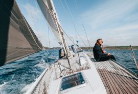 Emma Claire guest on deck under sail Devon
