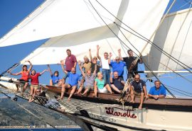Florette waving guests bowsprit