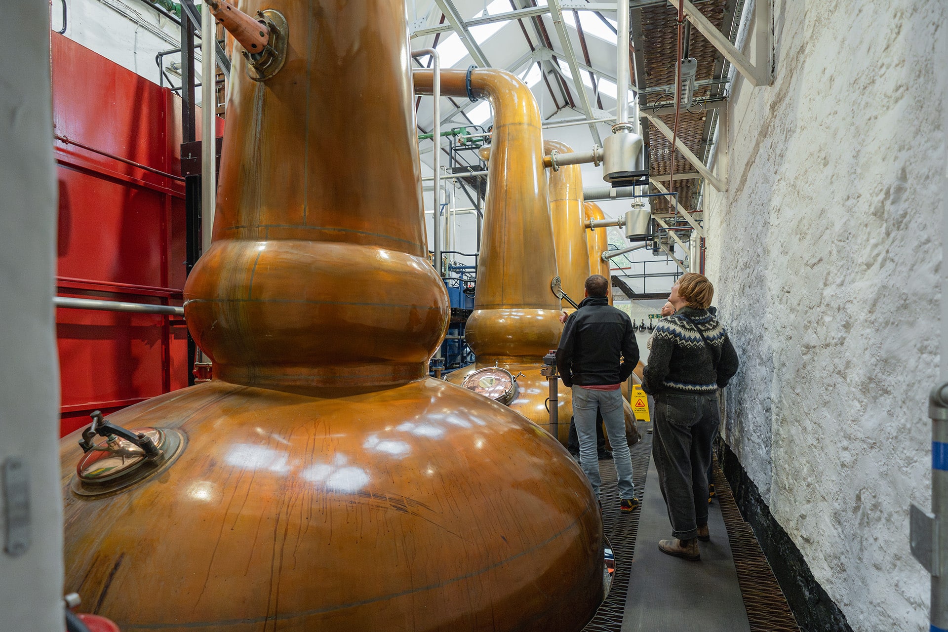 Flying Dutchman guests touring the Tobermory whisky distillery, Scotland