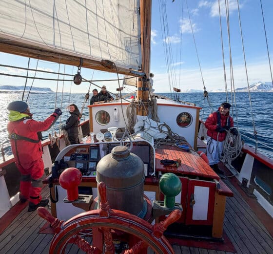 Goxsheim on deck traditional boat sailing in svalbard Arctic circle norway