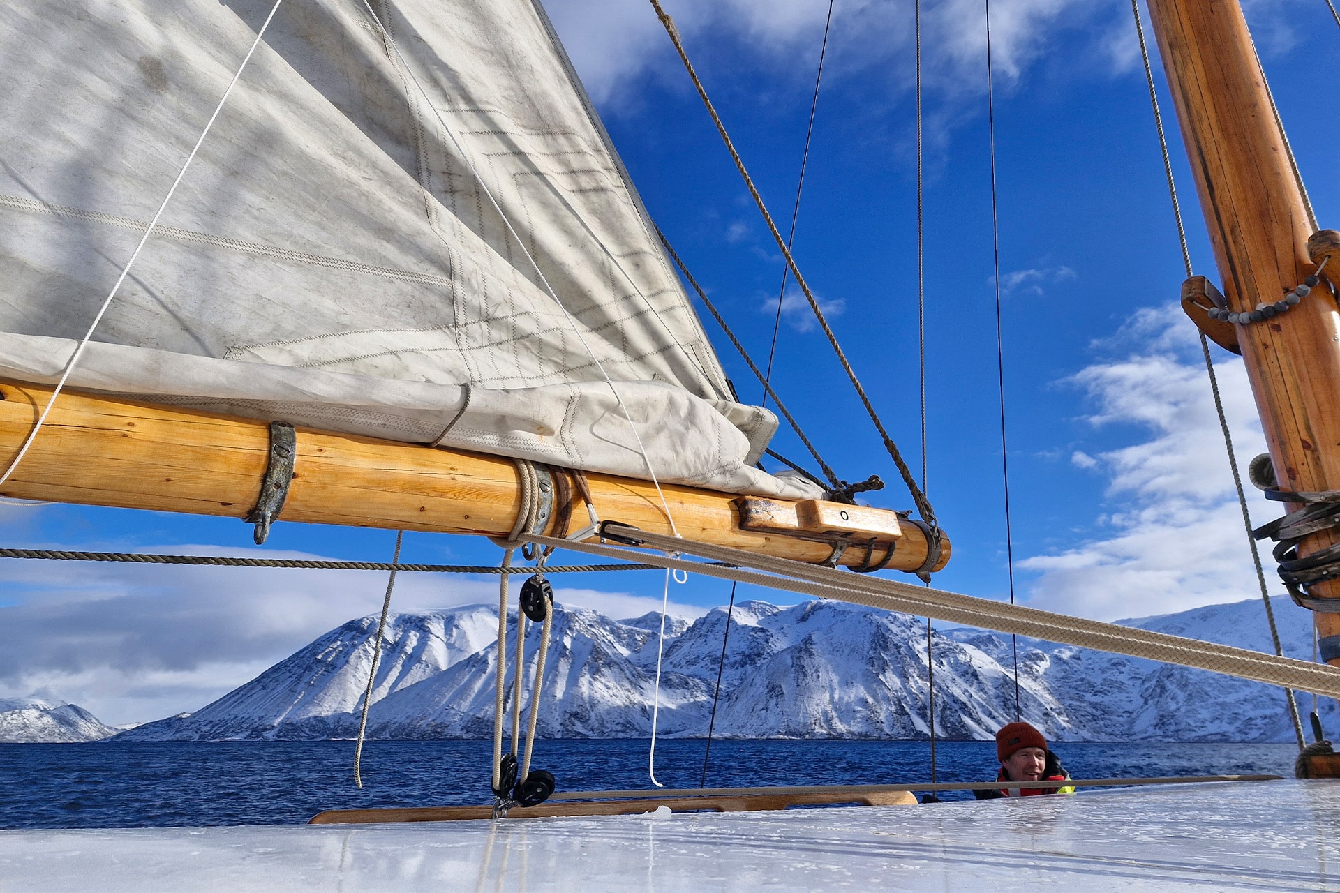 Goxsheim view on deck of snowy mountains Arctic Circle Sailing Svalbard traditional boat