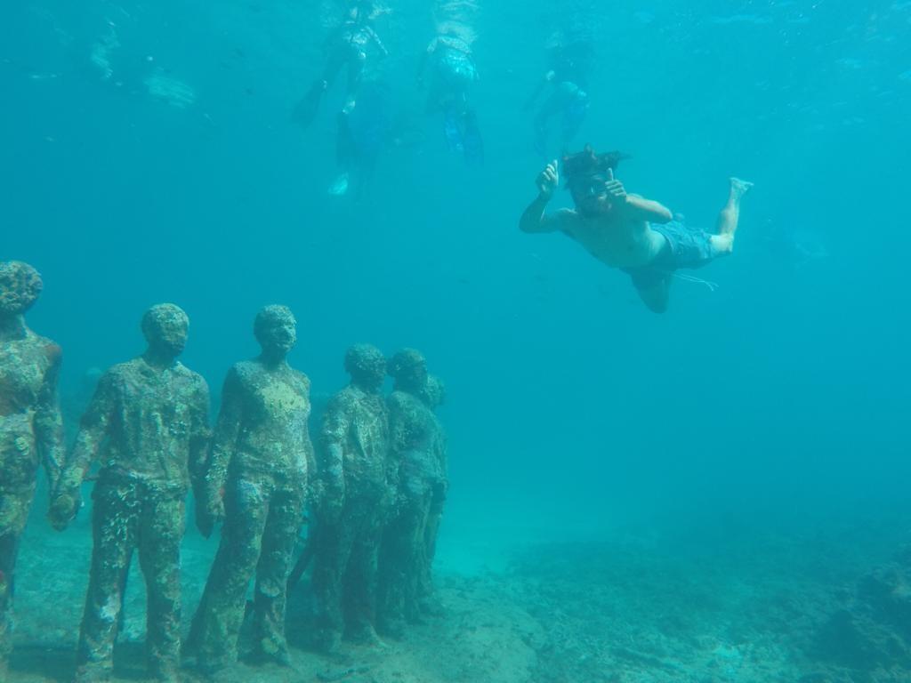 Diver underwater at the Molinere Bay Sculpture Park