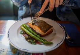 Guest eating meal on Blue Clipper