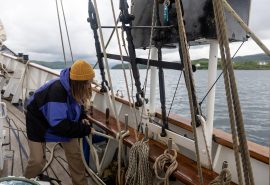 Guest tying ropes on board Blue Clipper