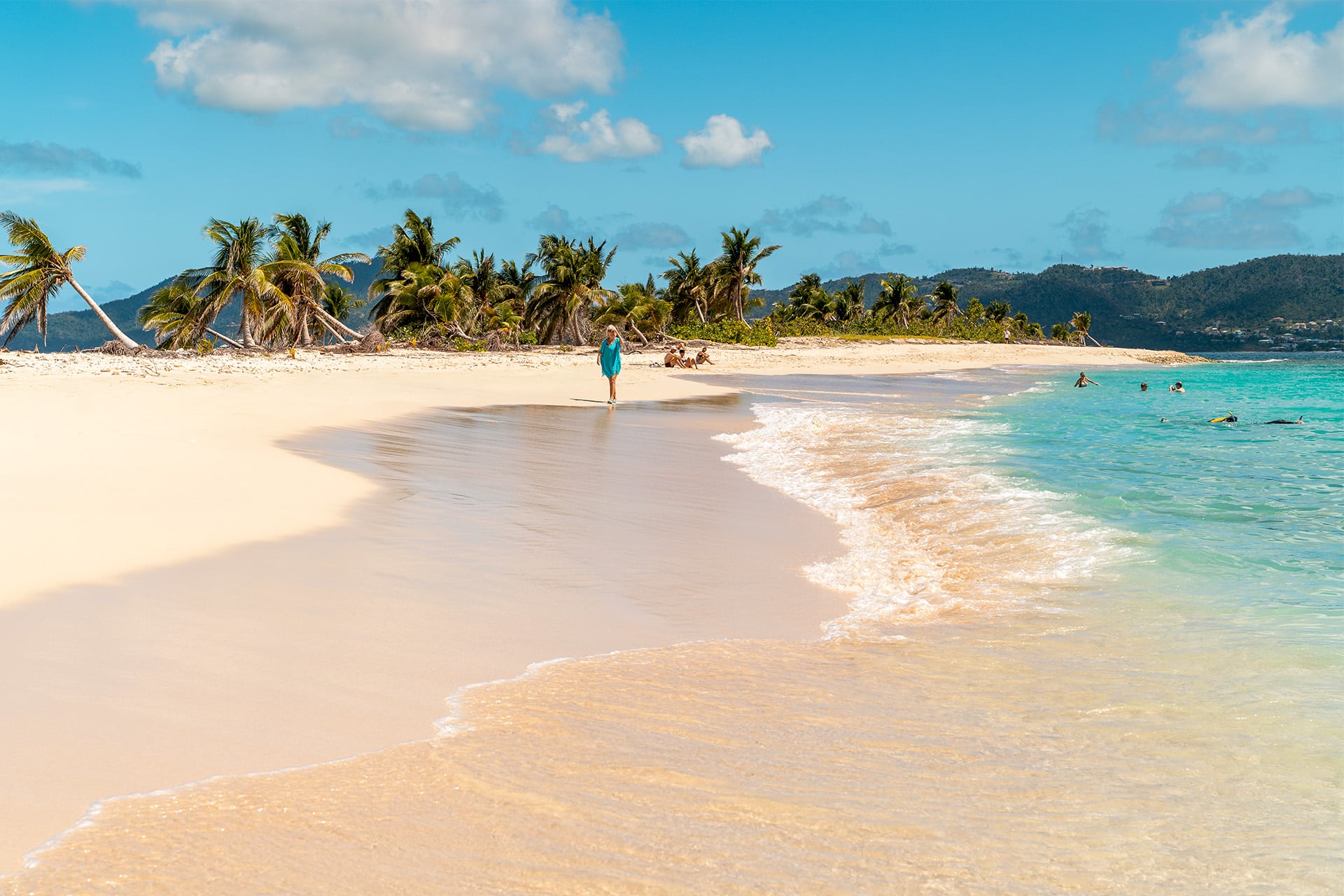 Guest walking along sandy beach off Carriacou, Grenada, Caribbean