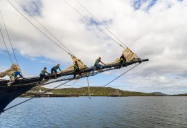 Guests climbing the bowsprit of Blue Clipper