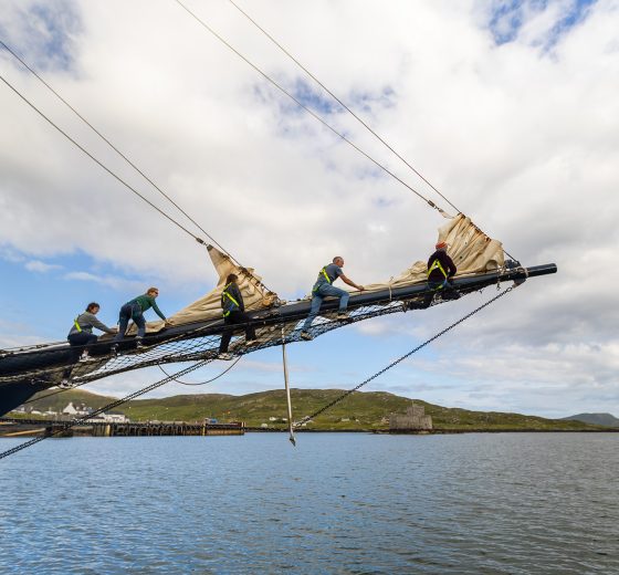 Guests climbing the bowsprit of Blue Clipper
