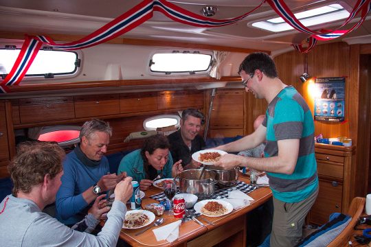 Guests eating on board Humla saloon interior