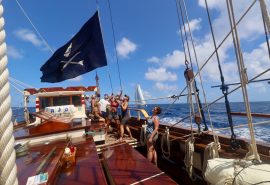 Guests hoisting flag on board Florette