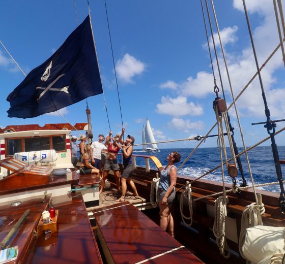 Guests hoisting flag on board Florette