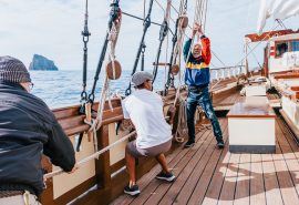 Guests hoisting sails on Florette