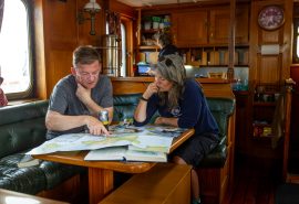 Guests in saloon of Blue Clipper
