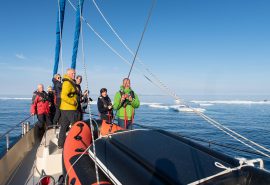 Guests on deck of Valiente in arctic Svalbard