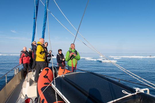 Guests on deck of Valiente in arctic Svalbard