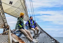 Guests on the bowsprit of Blue Clipper